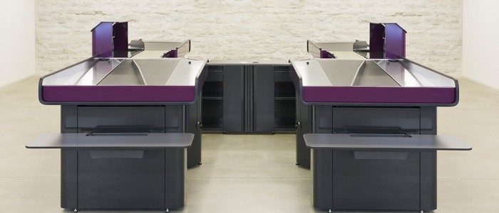 connected supermarket checkout counters with packing areas